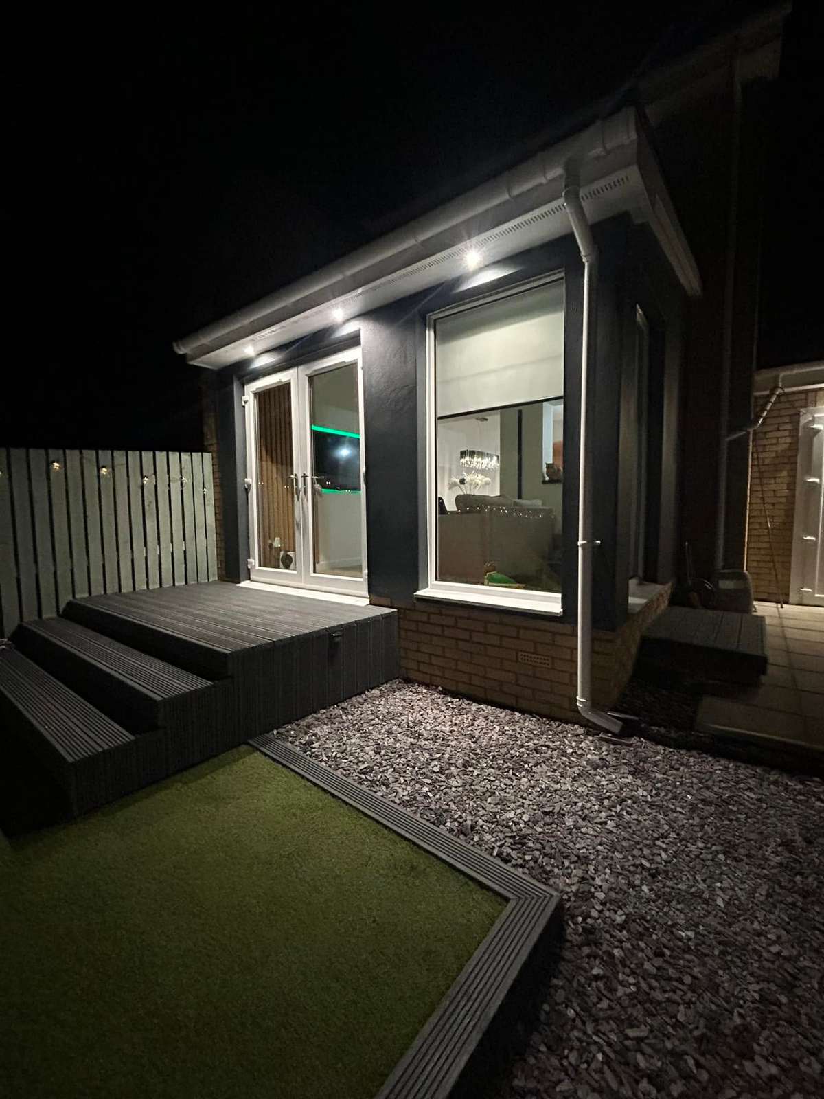 Steps up to a cabin entrance, at night